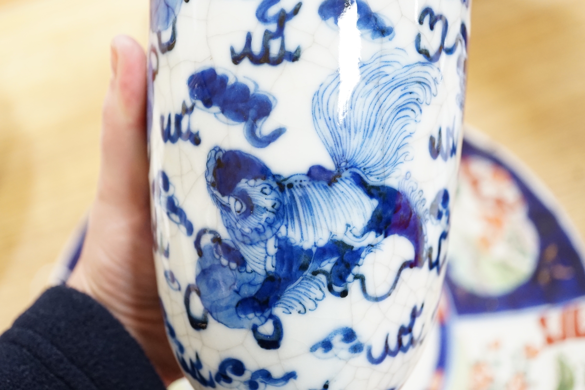 A Chinese two handled crackle glaze vase, Kangxi mark, but late 19th century, together two Imari plates, 37cm diameter